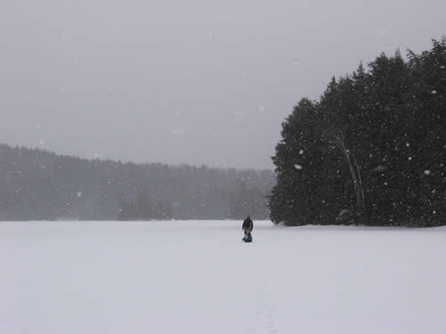Mark walking in the snow flurries.