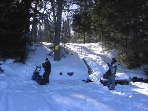 Portage done, short break before crossing Cache Lake.