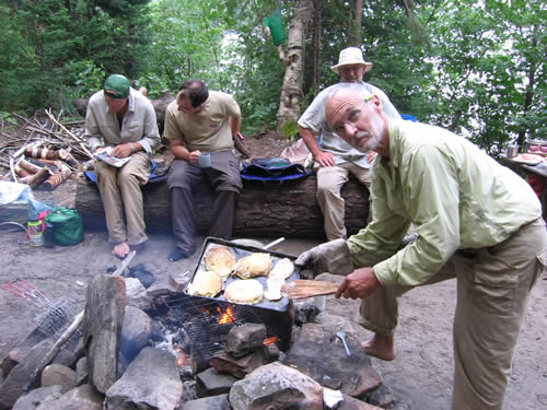 John shows off his cooking skills.