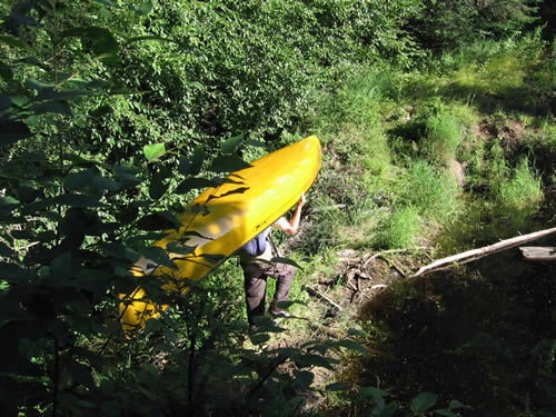 Jeffrey portaging across old beaver dam.