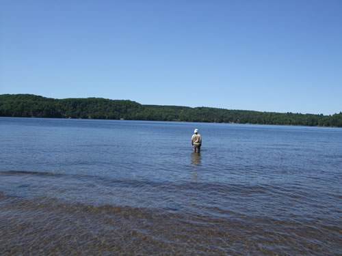 John cools off in the lake.