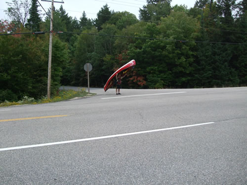 Crossing Highway 60 with the canoe.