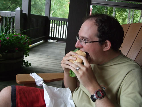 Jeff dives into his hamburger.