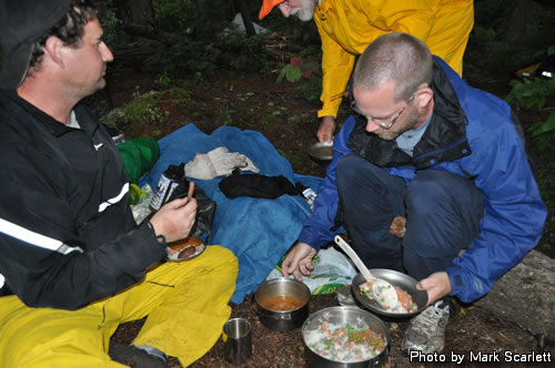 Serving supper, still under a small tarp.