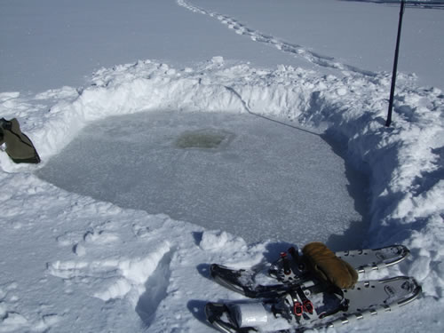 A thick layer of snow and solid ice underneath.