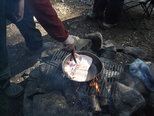 Nothing says camping like bacon over the fire.
