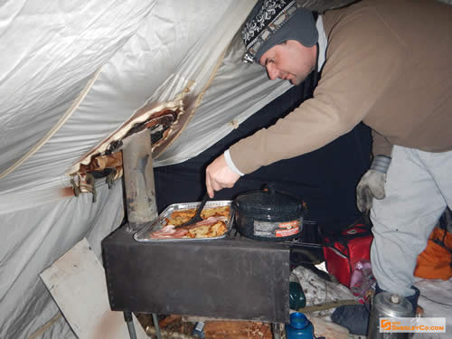 Markus attempting french toast on the roaring wood stove.