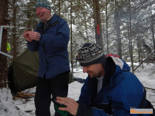 Glen laughs while Markus plays with his cellphone.