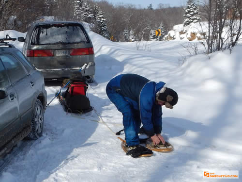 Markus strapping on the old school snowshoes.