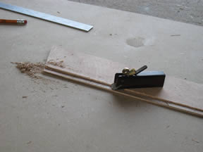 Miniature plane used to cut gains in planks.